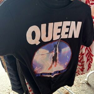 Black shirt with Queen brand print.